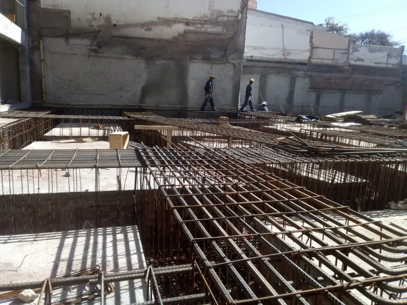 Beam and slab reinforcement laid out at the foundation level of the building