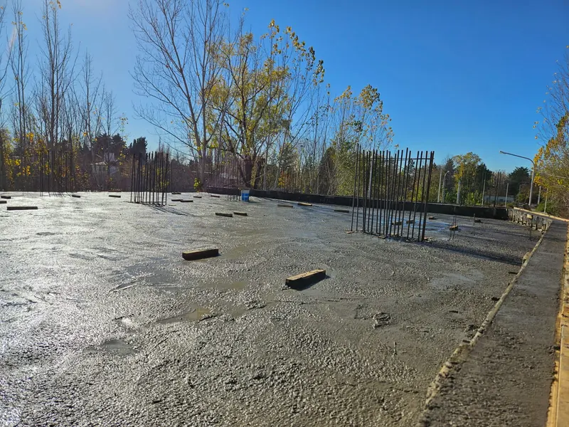 Finished slab surface with column starter bars and perimeter formwork