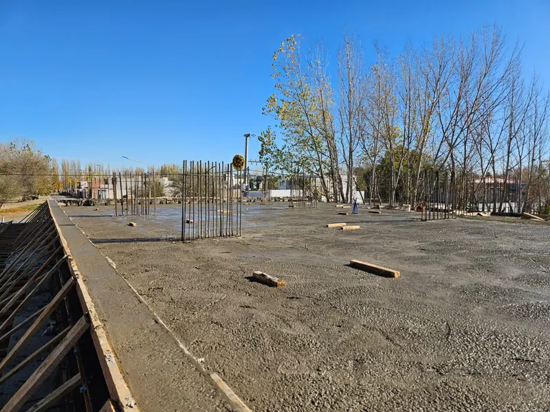 Poured slab with starter bars and timber edge formwork