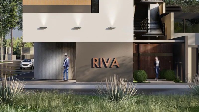 Render of the pedestrian entrance to Edificio RIVA, the name in relief on the pale wall and downlights recessed in the soffit.