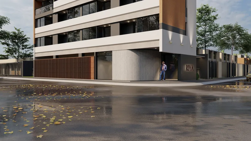 Render of Edificio RIVA seen from the corner, the whole building foreshortened above the wet roadway.