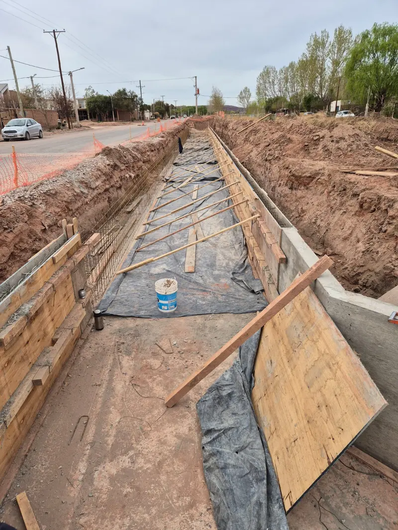 Channel excavation with polythene sheeting and timber formwork made ready