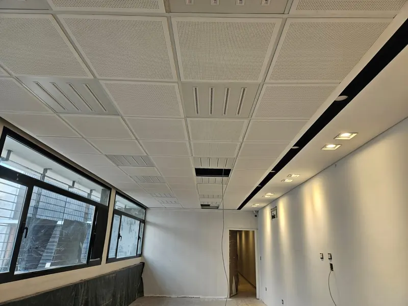 Finished interior with demountable ceiling, recessed light fittings and windows