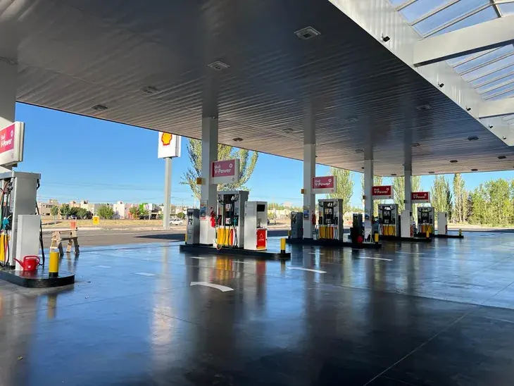 Finished forecourt with Shell pumps under the steel canopy and painted road markings