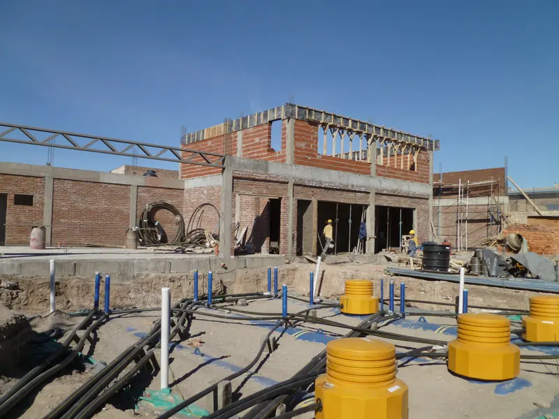 Station shop in brick masonry with the forecourt under construction