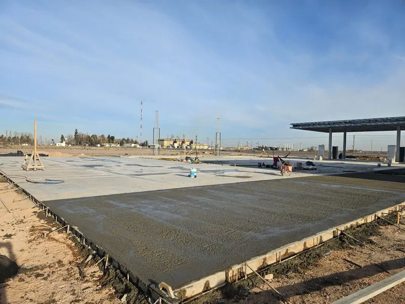 Newly cast concrete forecourt with the station canopy in the background