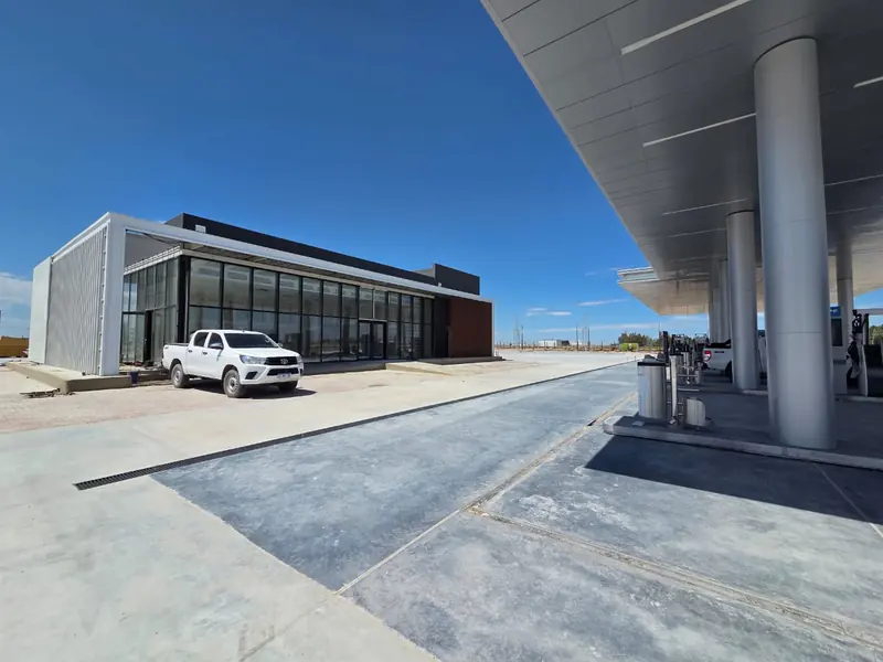 Completed shop building seen from under the forecourt canopy