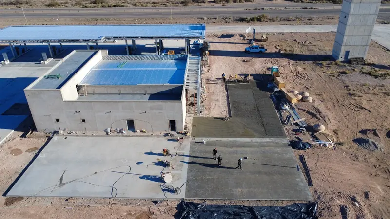 Aerial view of the services area with sheet metal roofing and a concrete pour under way